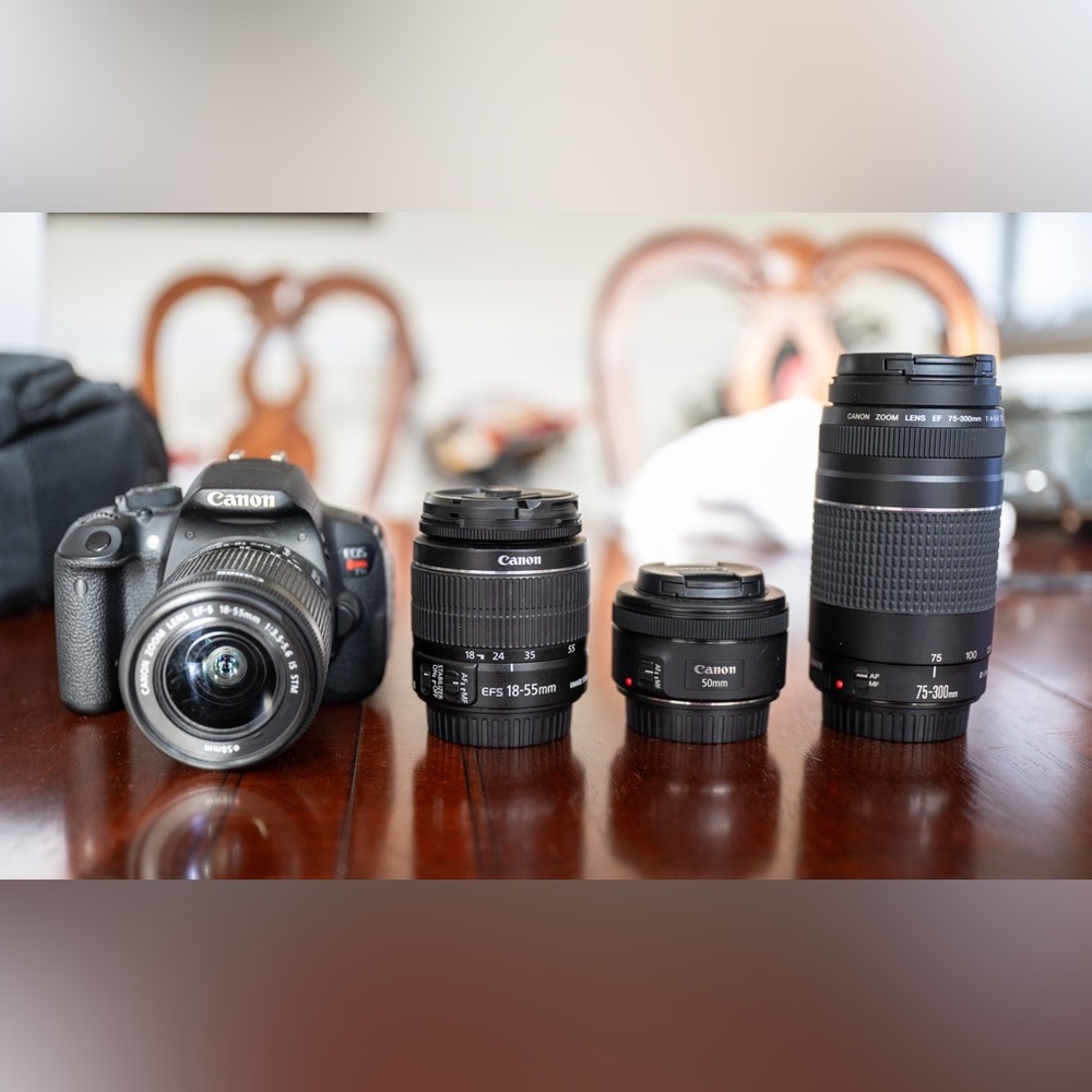 CANON REBEL T5i BODY AS WELL AS 4 BATTERIES IN TOTAL, 4 LENSES IN TOTAL